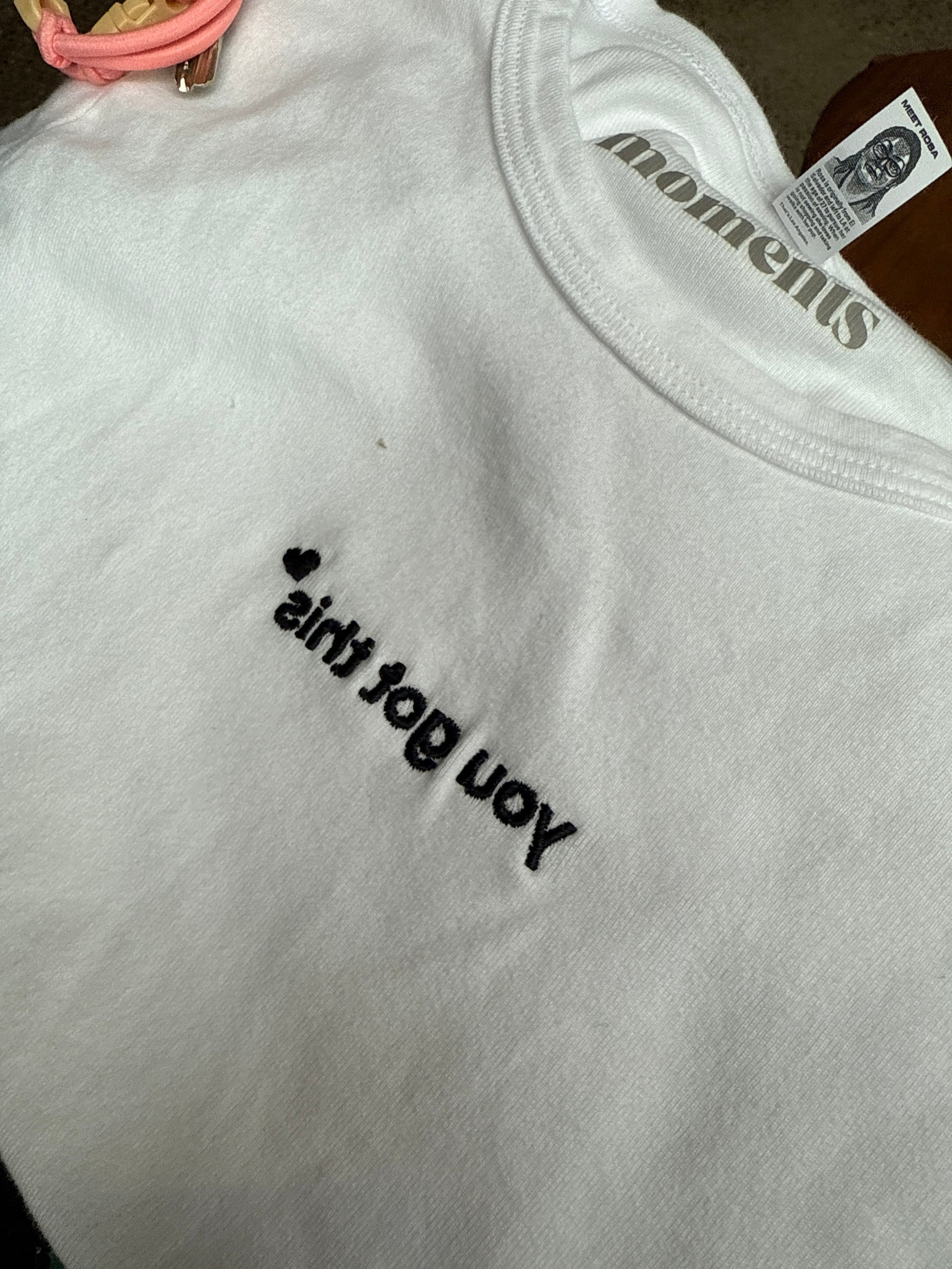 close up embroidery you got this text white affirmation baby tee detail minimalist