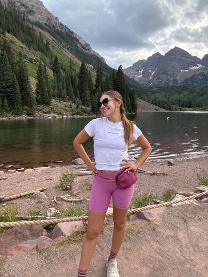 woman wearing white affirmation t-shirt you are glowing outdoor mountain lake lifestyle casual