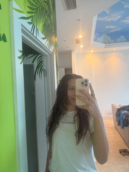 girl wearing white affirmation t-shirt you are glowing mirror selfie positive self love casual