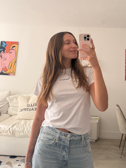 girl wearing white affirmation t-shirt you got this mirror selfie jeans casual living room lifestyle
