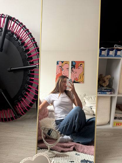 girl wearing white affirmation t-shirt you look good mirror selfie jeans relaxed artsy bedroom